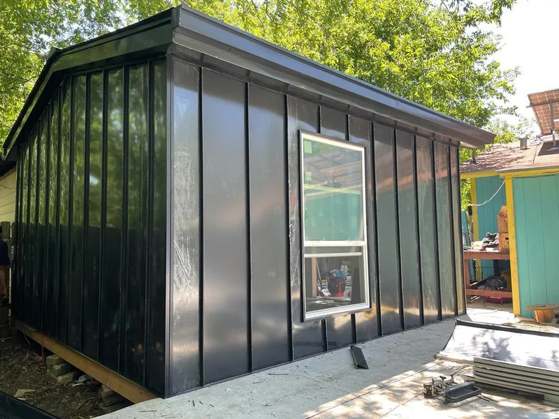 Black standing seam metal wall panels for Metal Roof Installation in Lewisville